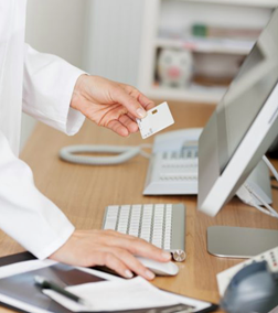 person entering information into a computer