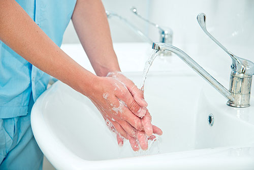 person washing their hands